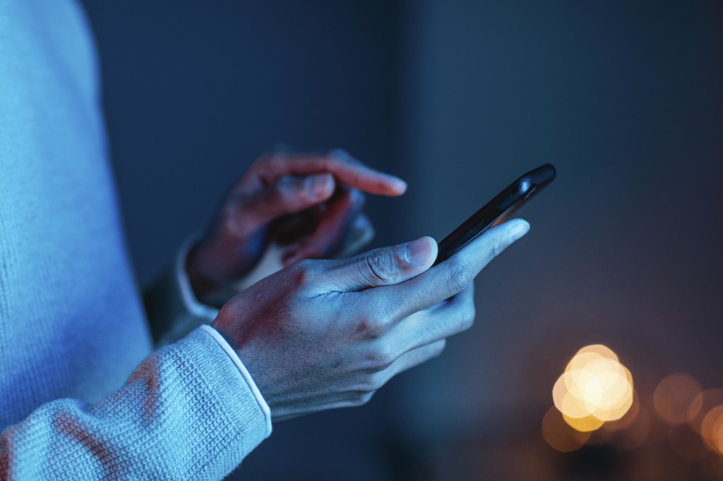 side-view-of-man-using-smartphone